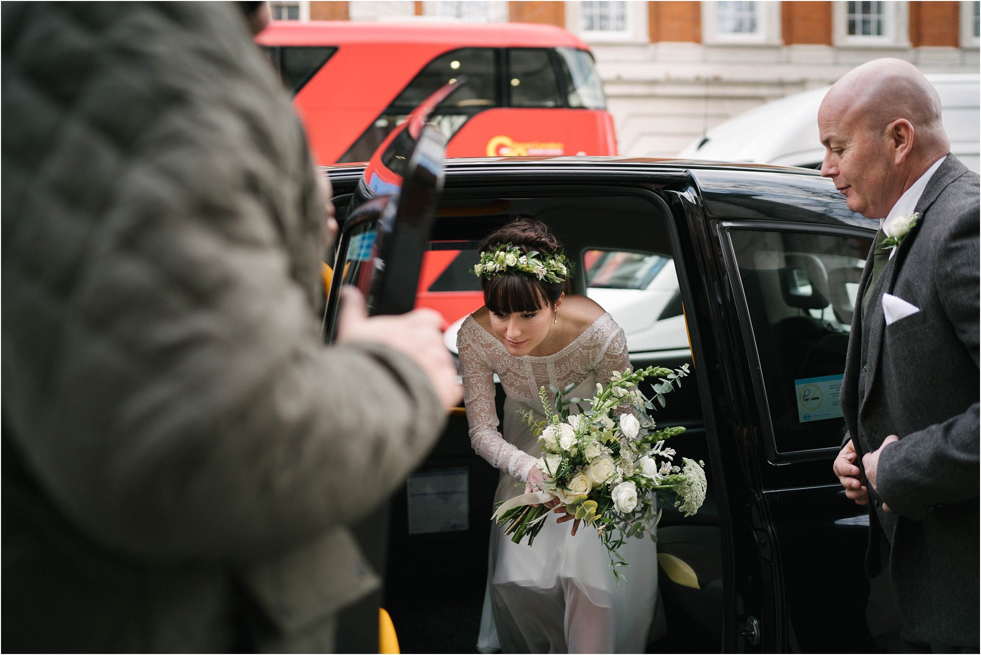 bride exiting black cab