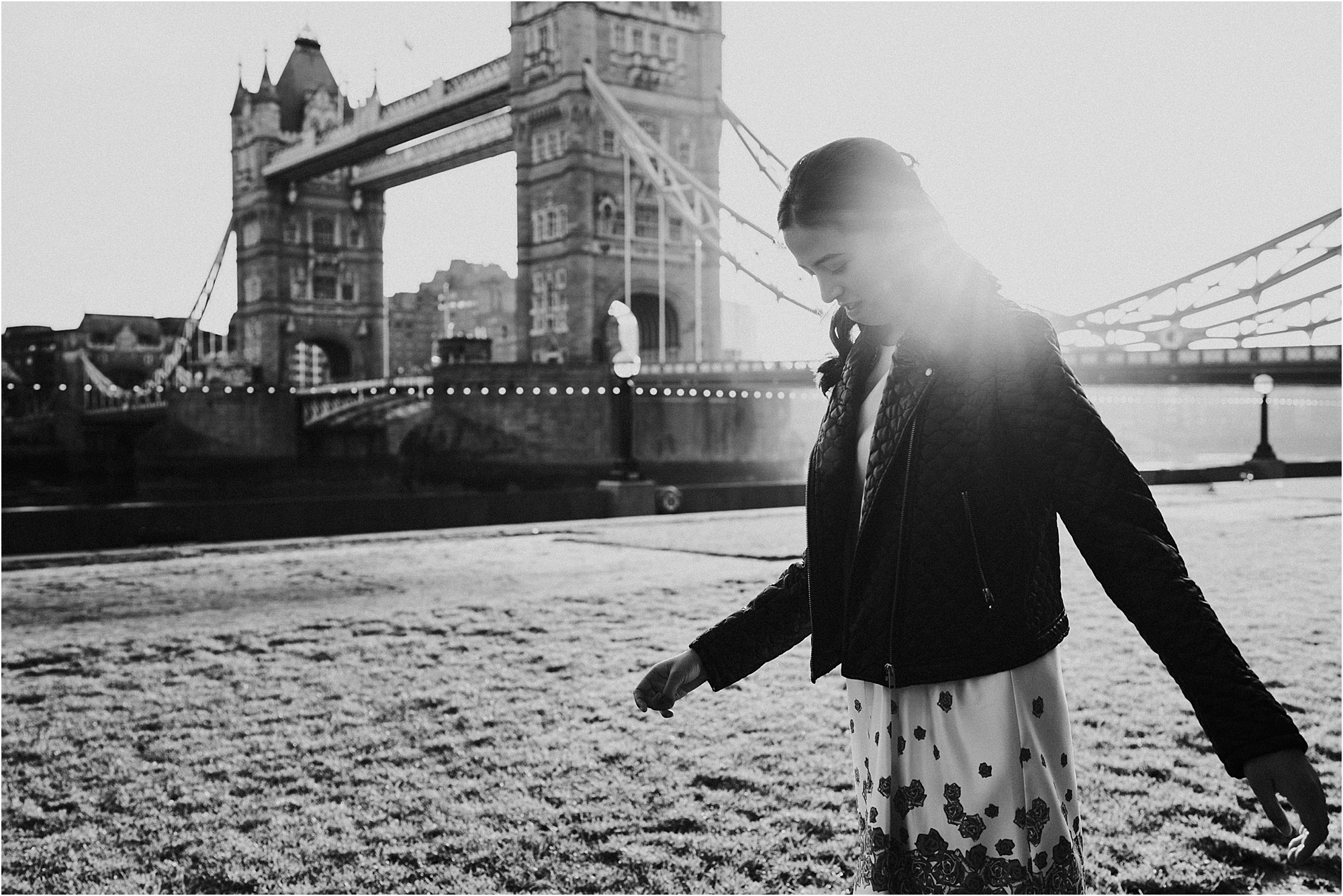 A black and white photo from an "American Style" Senior photo session at London's Tower Bridge. 