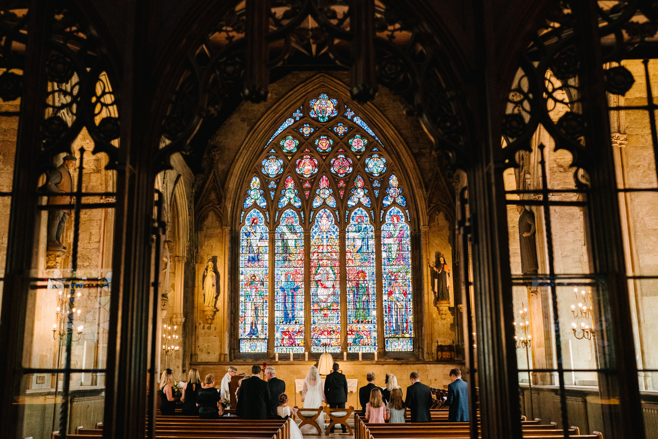 A small wedding ceremony talking place in St Etheldreda's Church in London. 