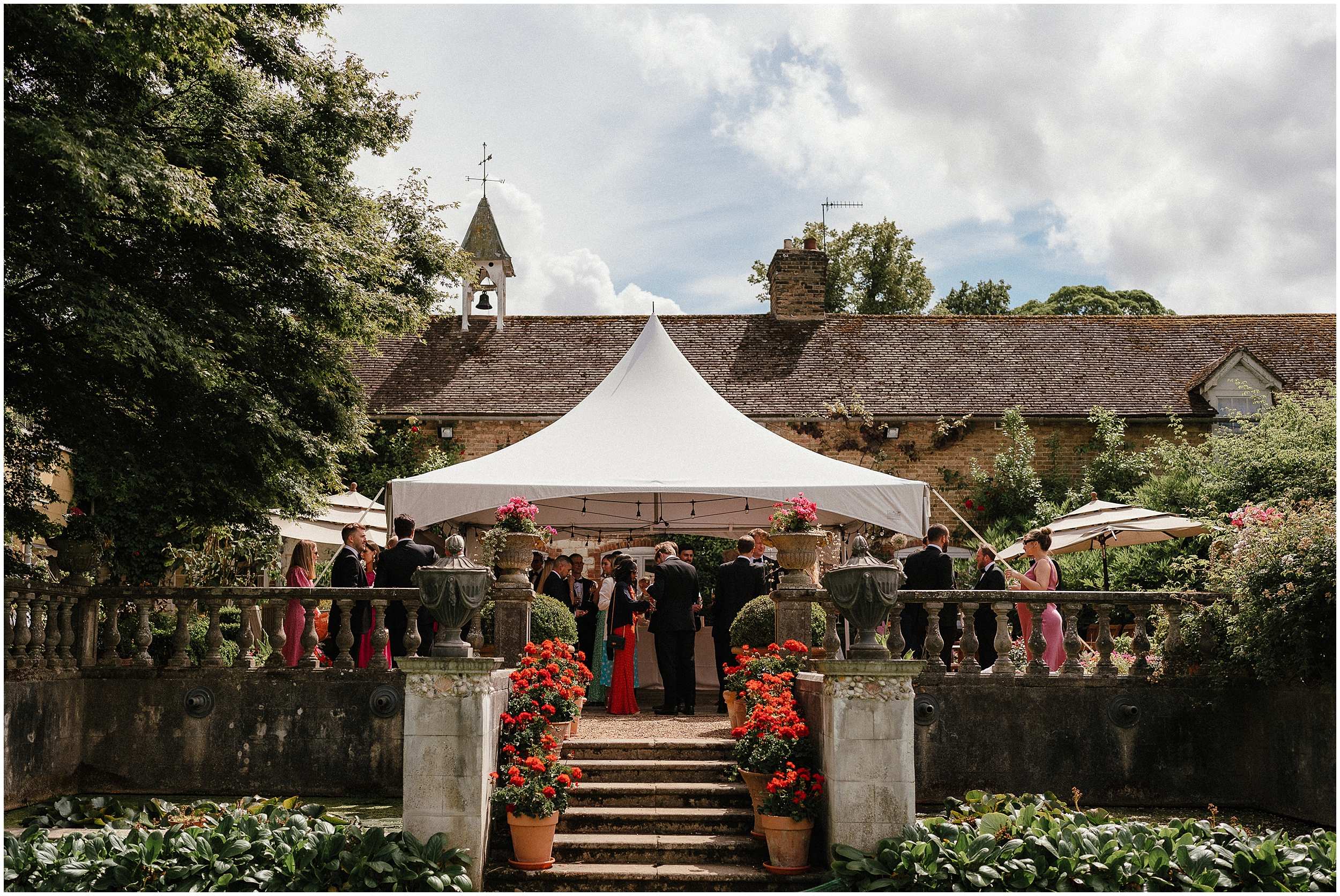 Wedding guests in the gardens of the old rectory estate. 