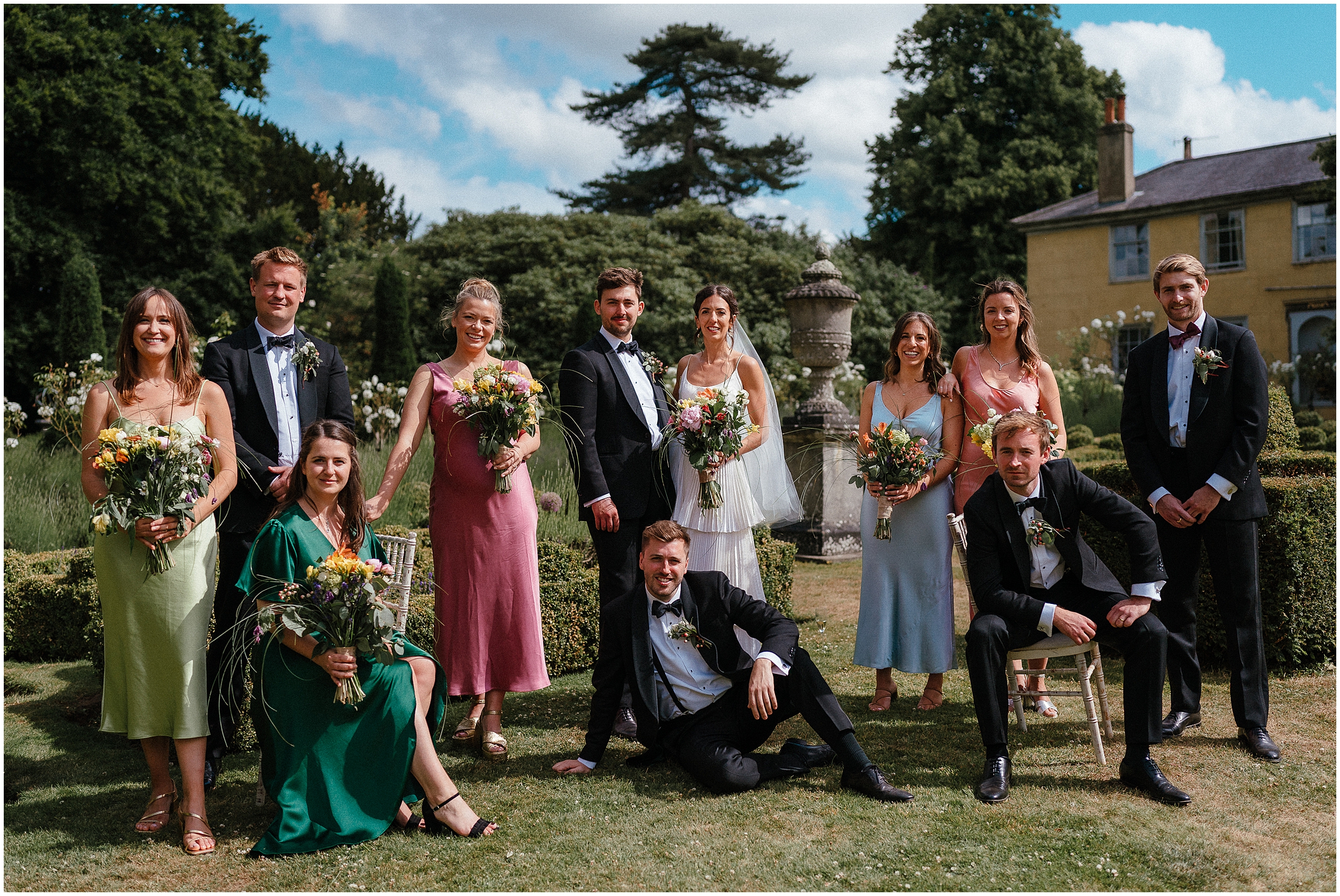 A wedding party in the gardens of the old rectory estate. 