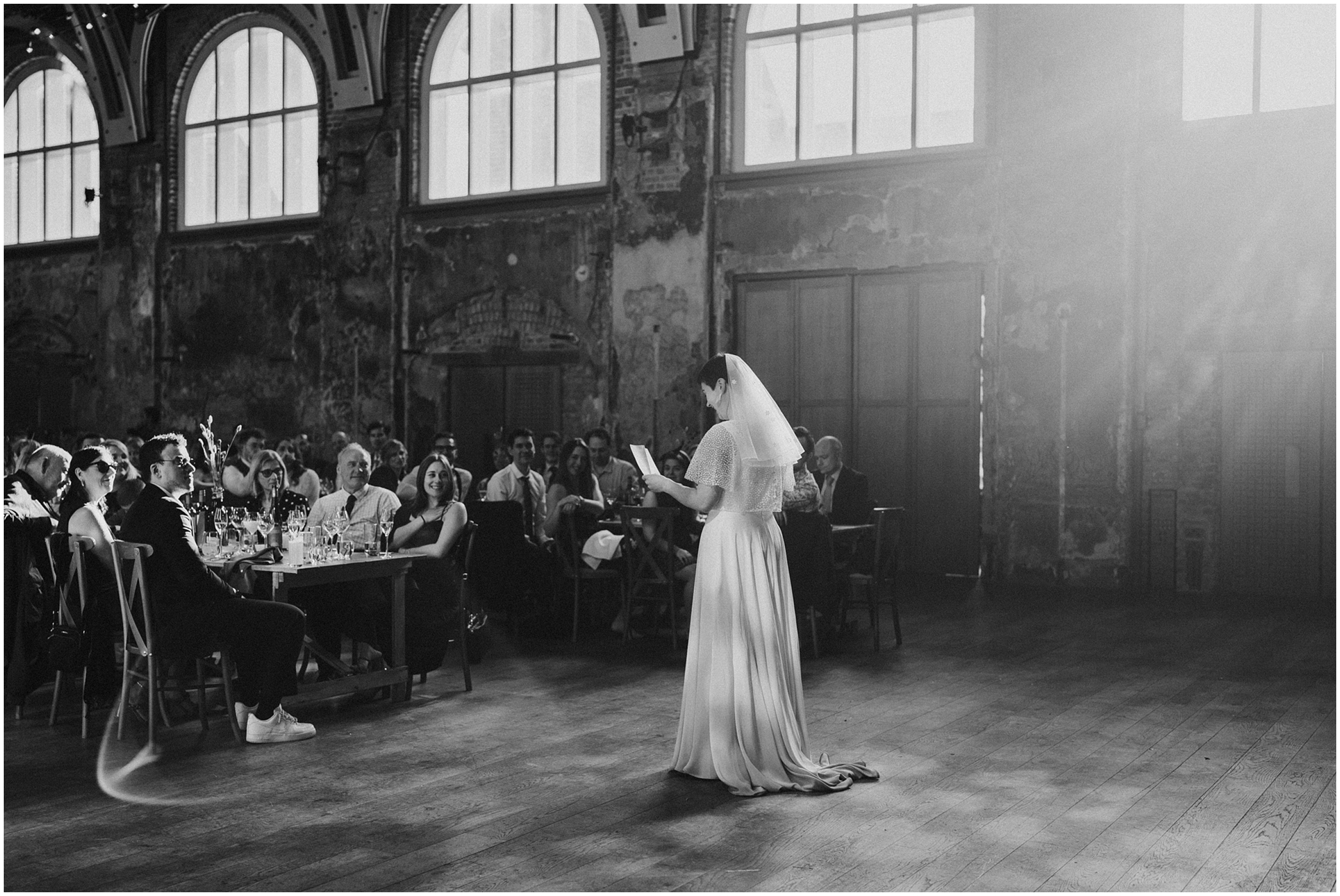 A bride giving a speech at the Battersea Arts Centre. 