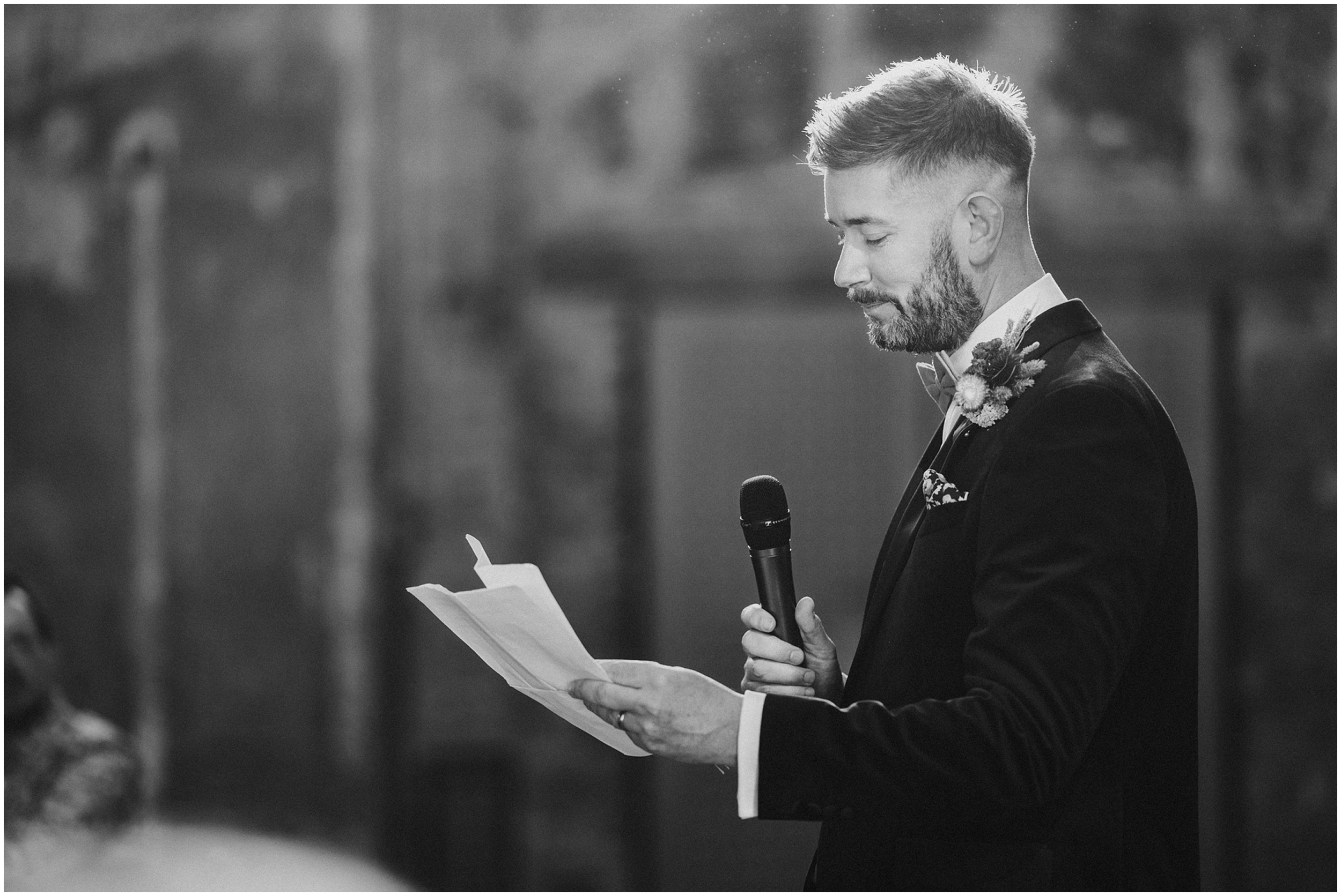 A groomsman giving a speech. 