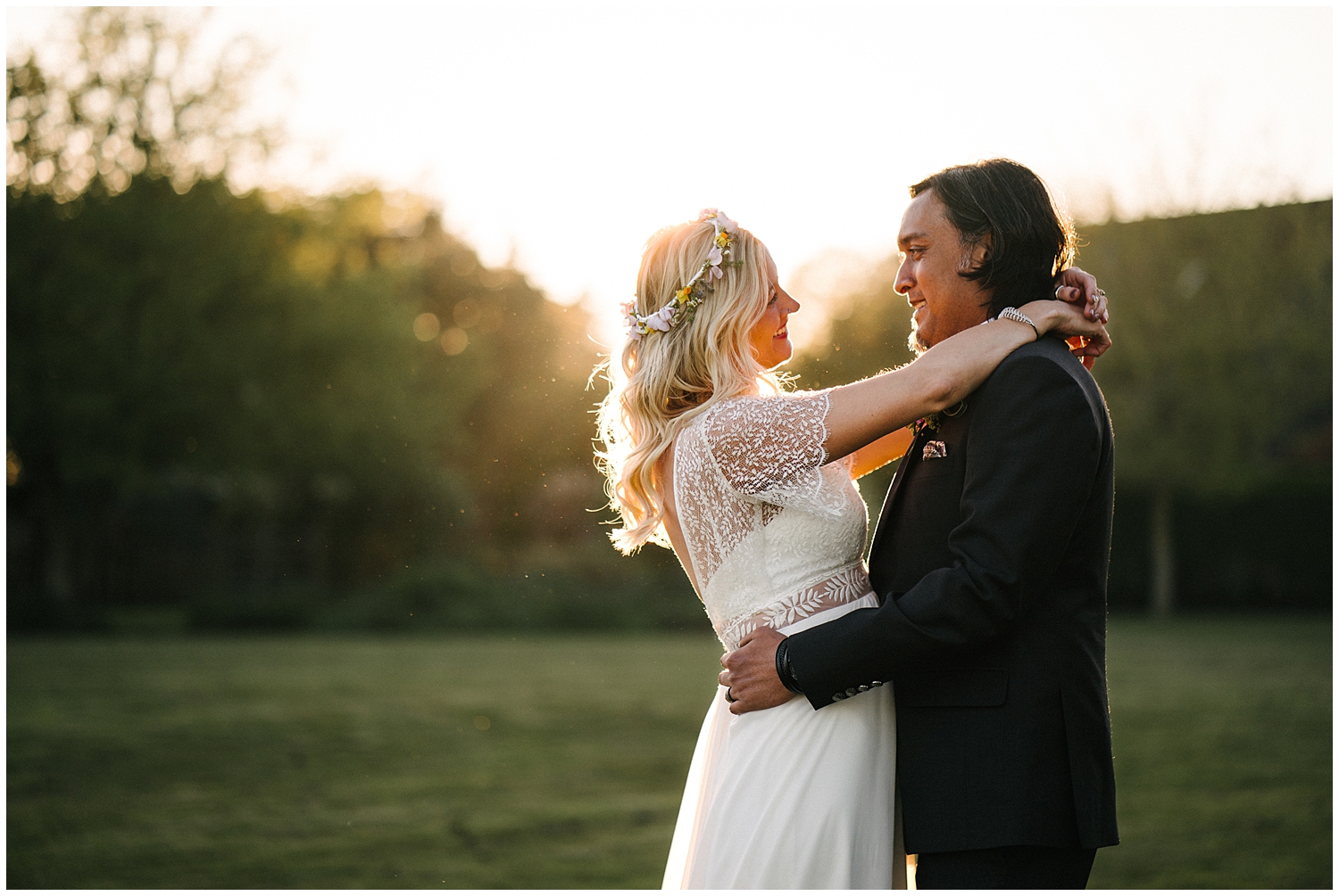 A couple during sunset at High House Weddings in Essex. Photographed by Kari Bellamy. 