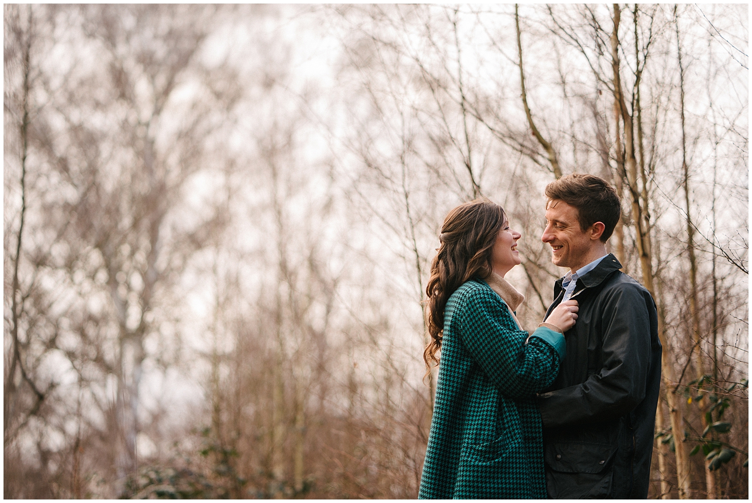 A couple in the woods during their engagement session and pre-wedding shoot. Photographed by Yorkshire Wedding Photographer Kari Bellamy. 