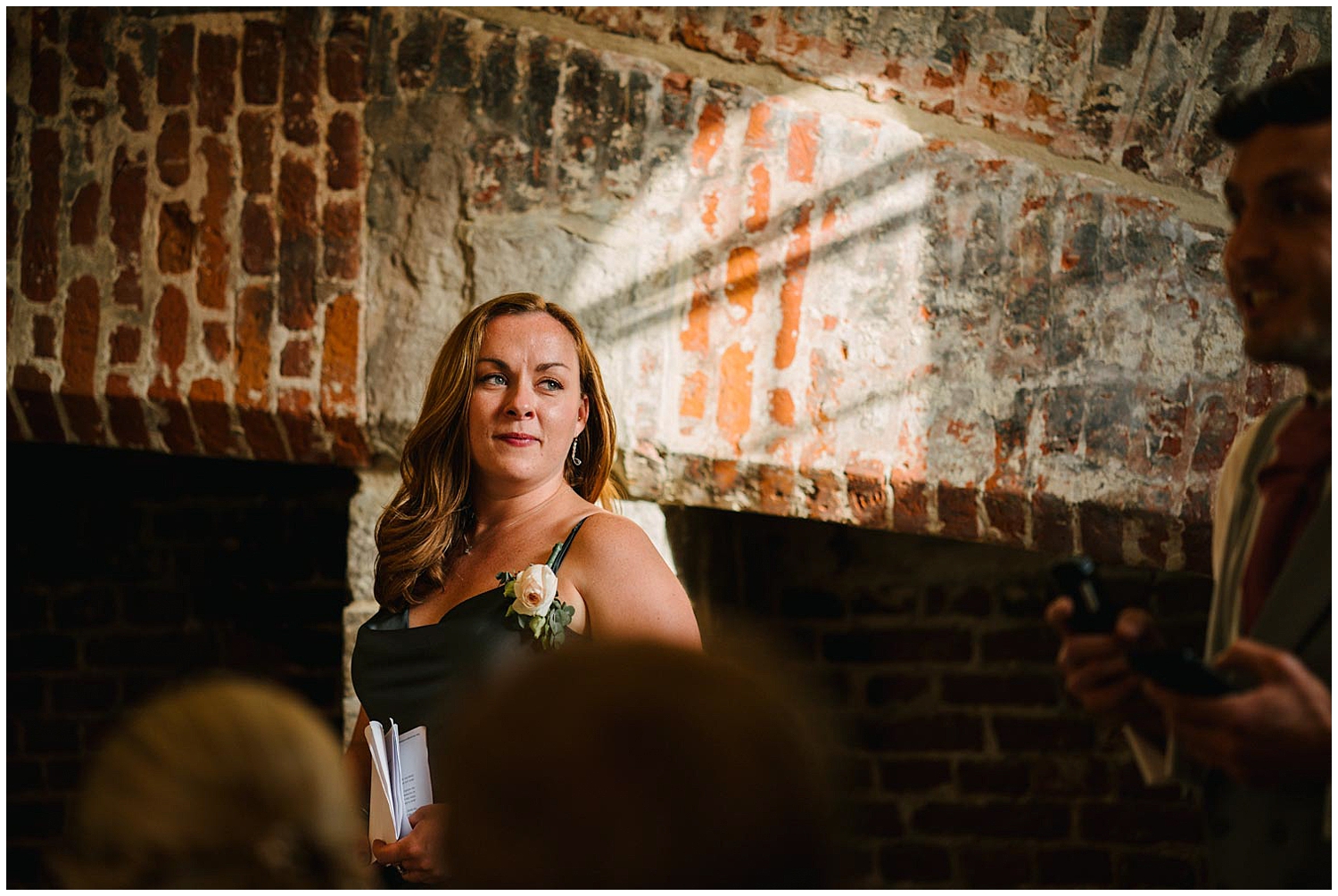 A bridesmaids during speeches at a wedding at Leeds Castle in Kent. Photographed by Kari Bellamy based in Yorkshire. 