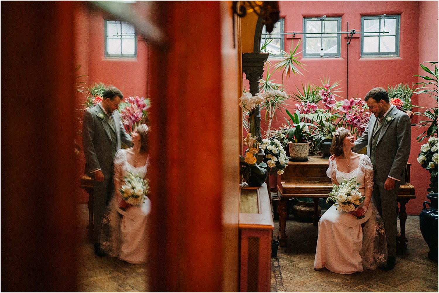 A bride and groom inside of Hampton Court House. 