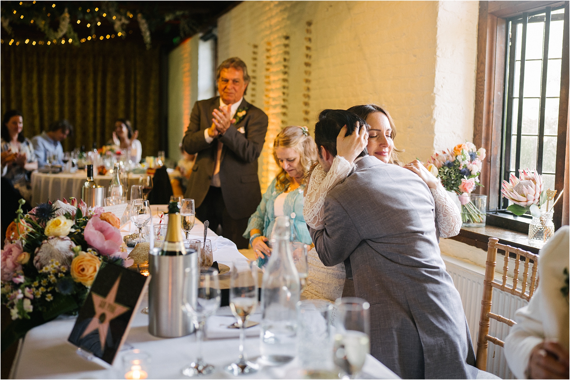 A post speech wedding hug at The Tudor Barn, Eltham, South London. 