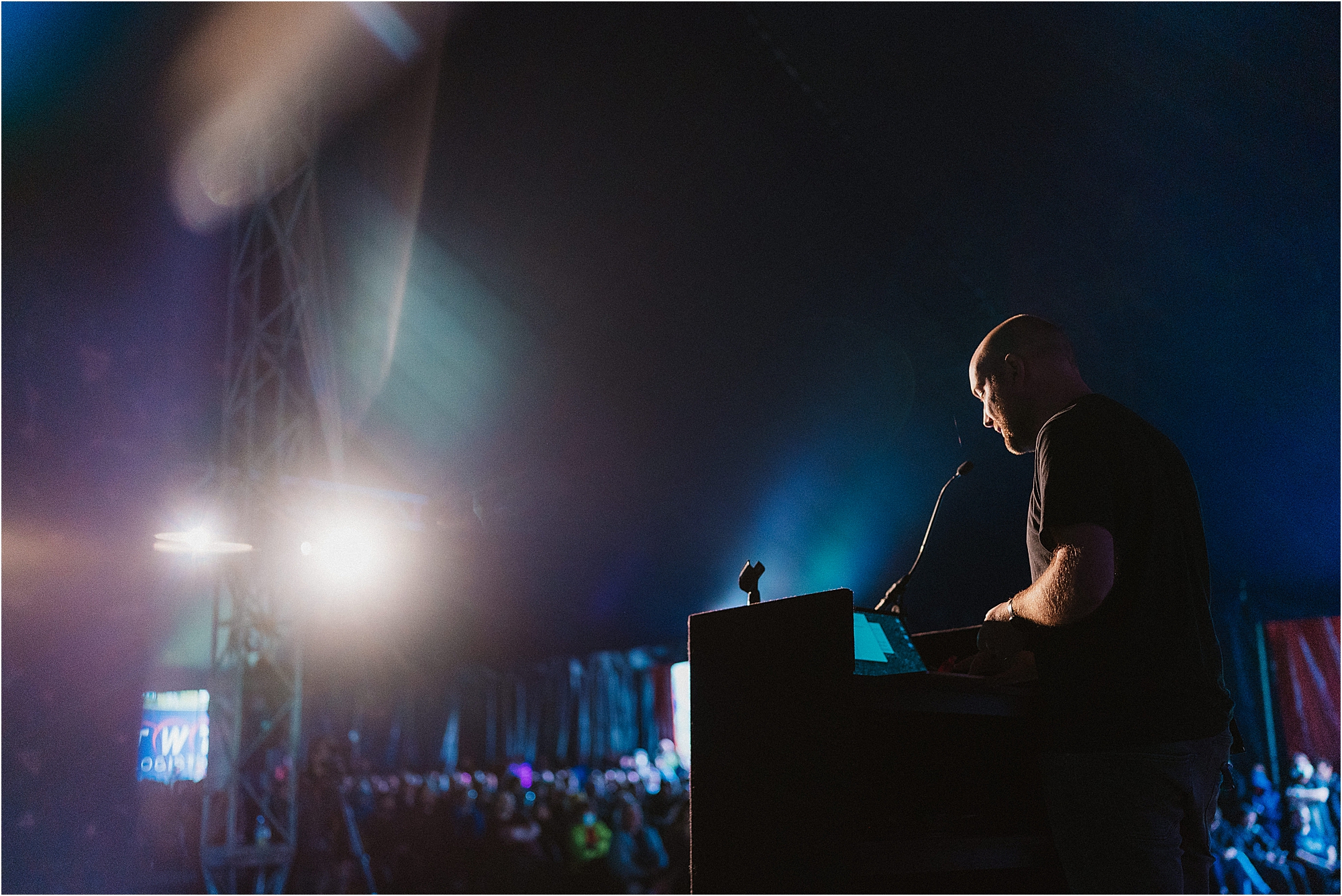 A photograph of a Jonty Wareing, giving a talk at EMF Festival. Photograph by corporate and event photographer Kari Bellamy. 