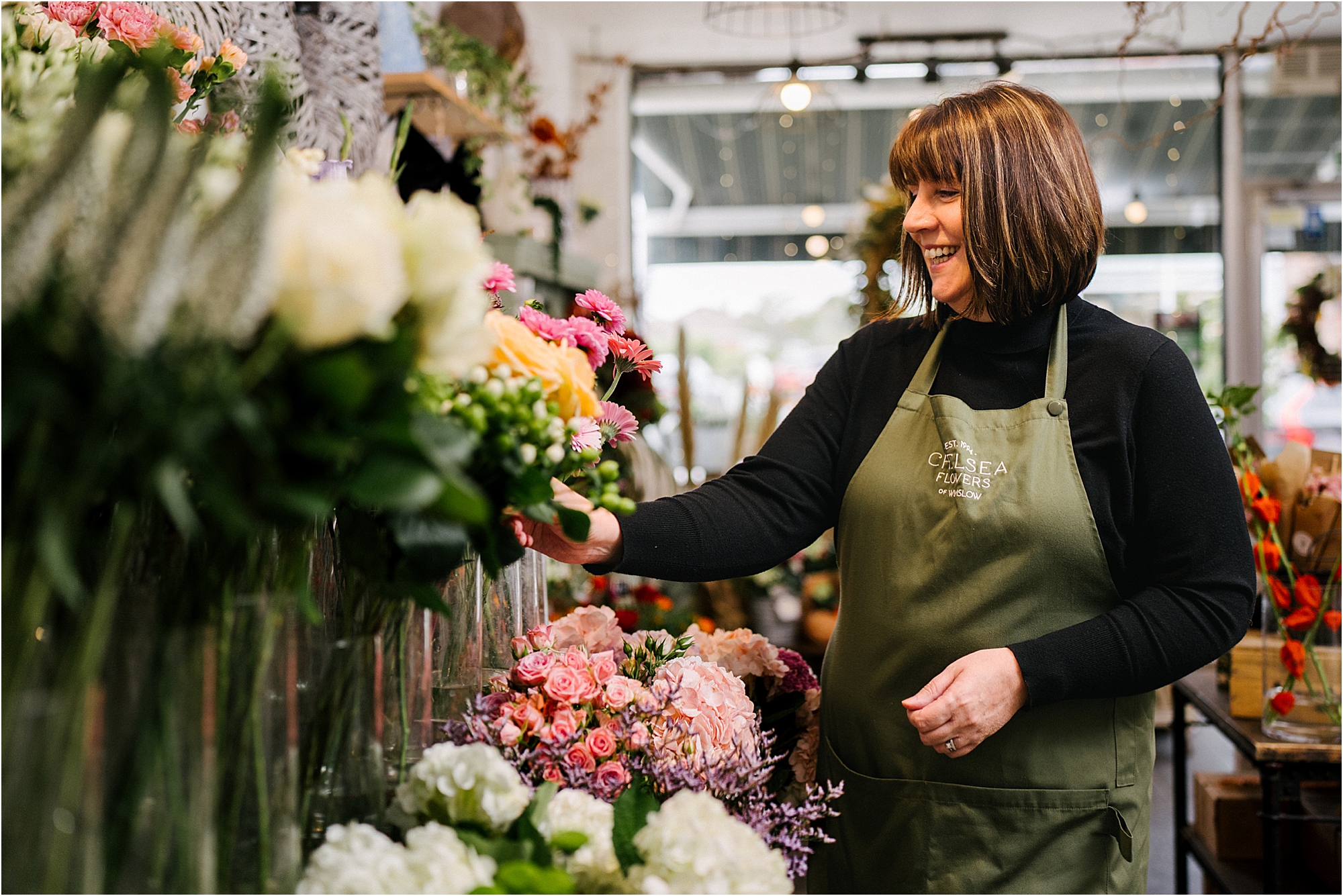 A branding portrait of a florist at work.